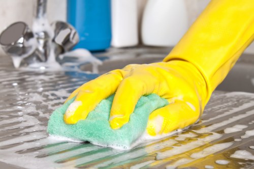 Technician performing deep cleaning on a sectional sofa